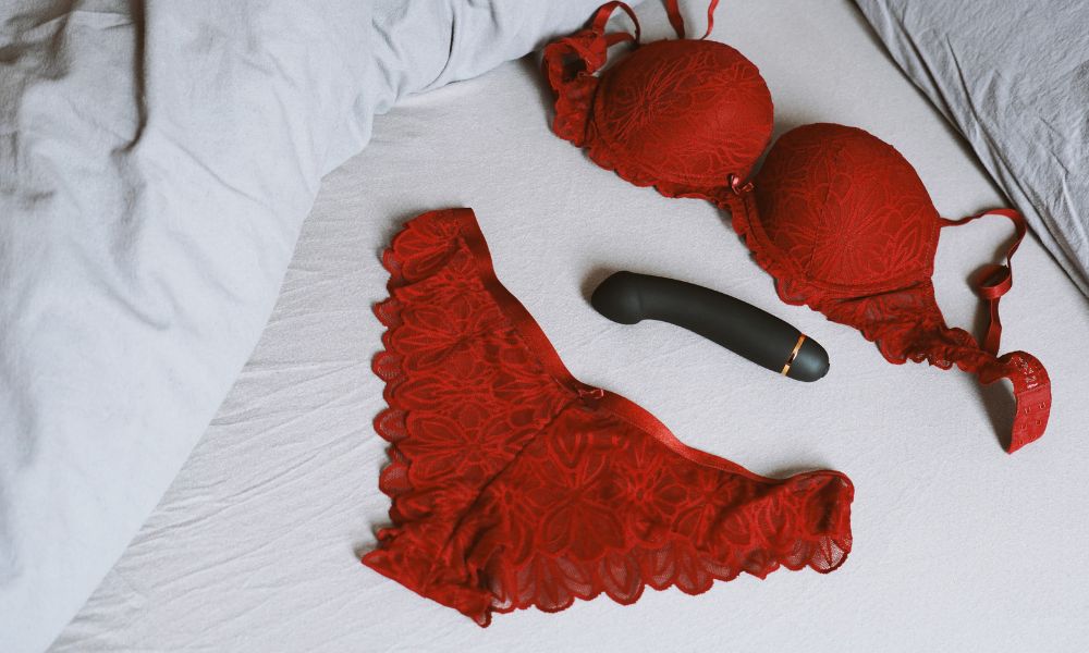 Underwear and dildo on the bed