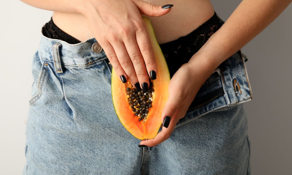 Woman holding papaya